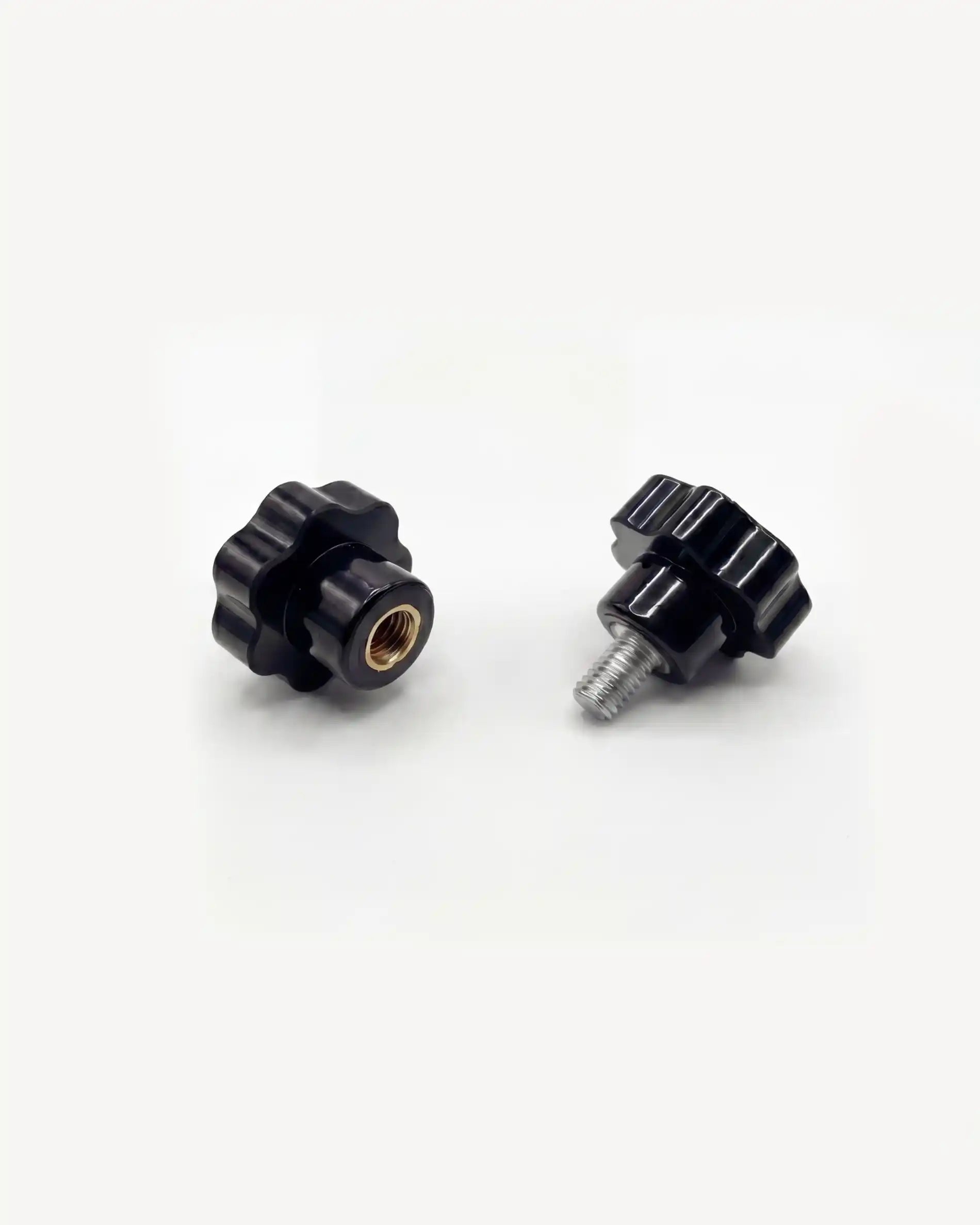 Pair of black PILOTIS adjustment knobs, top view