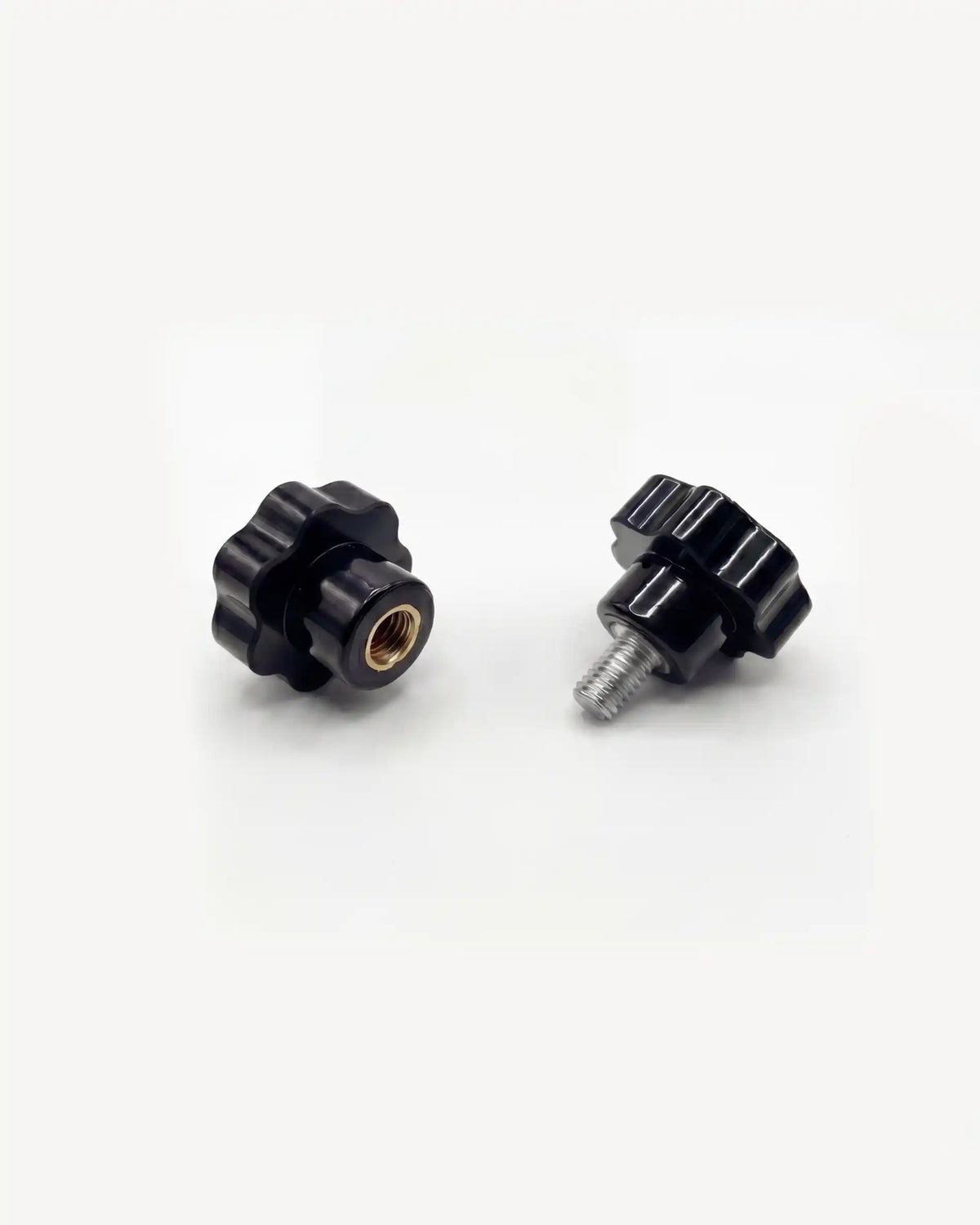 Pair of black PILOTIS adjustment knobs, top view