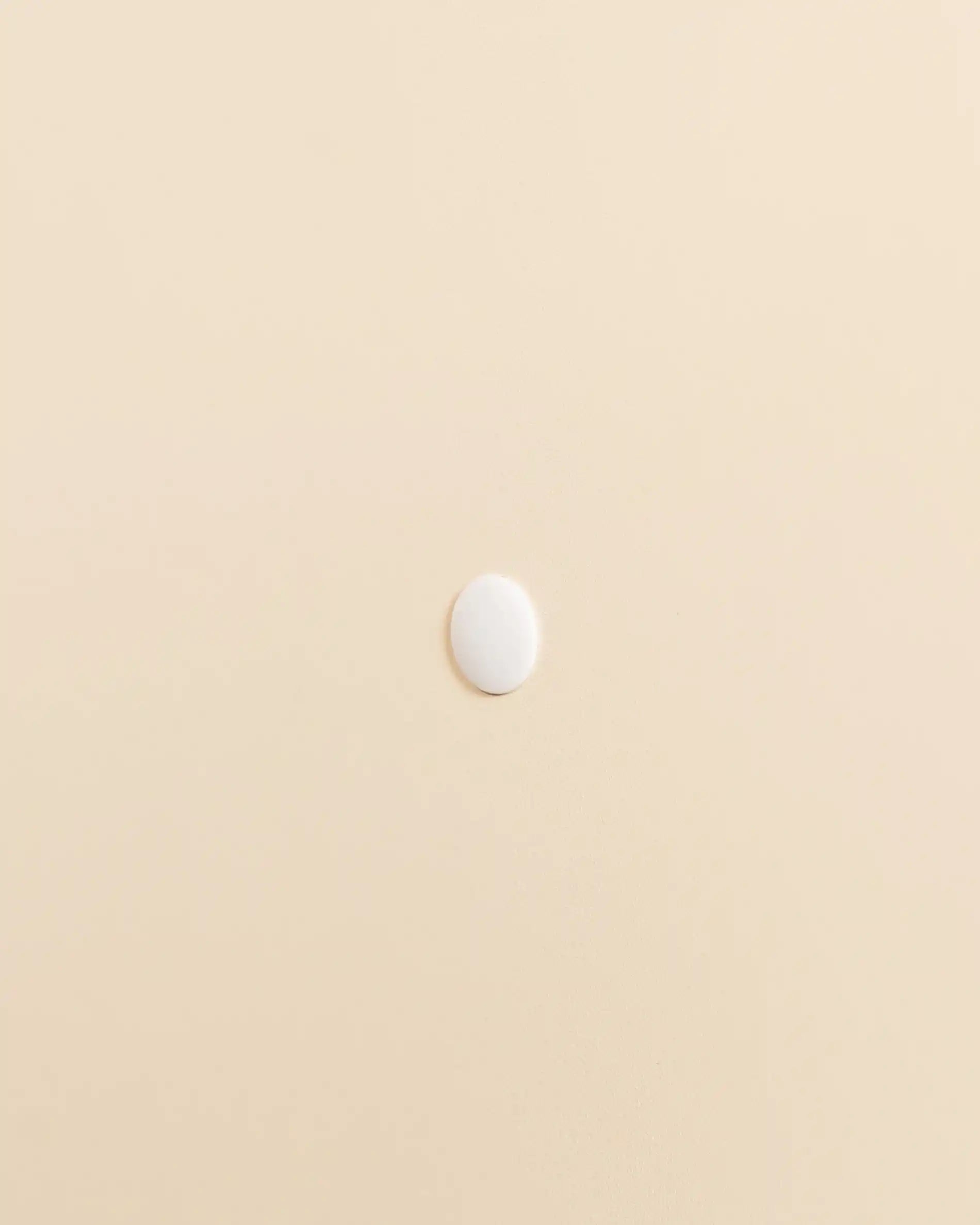 Beige cream PILOTIS screw cover, side view