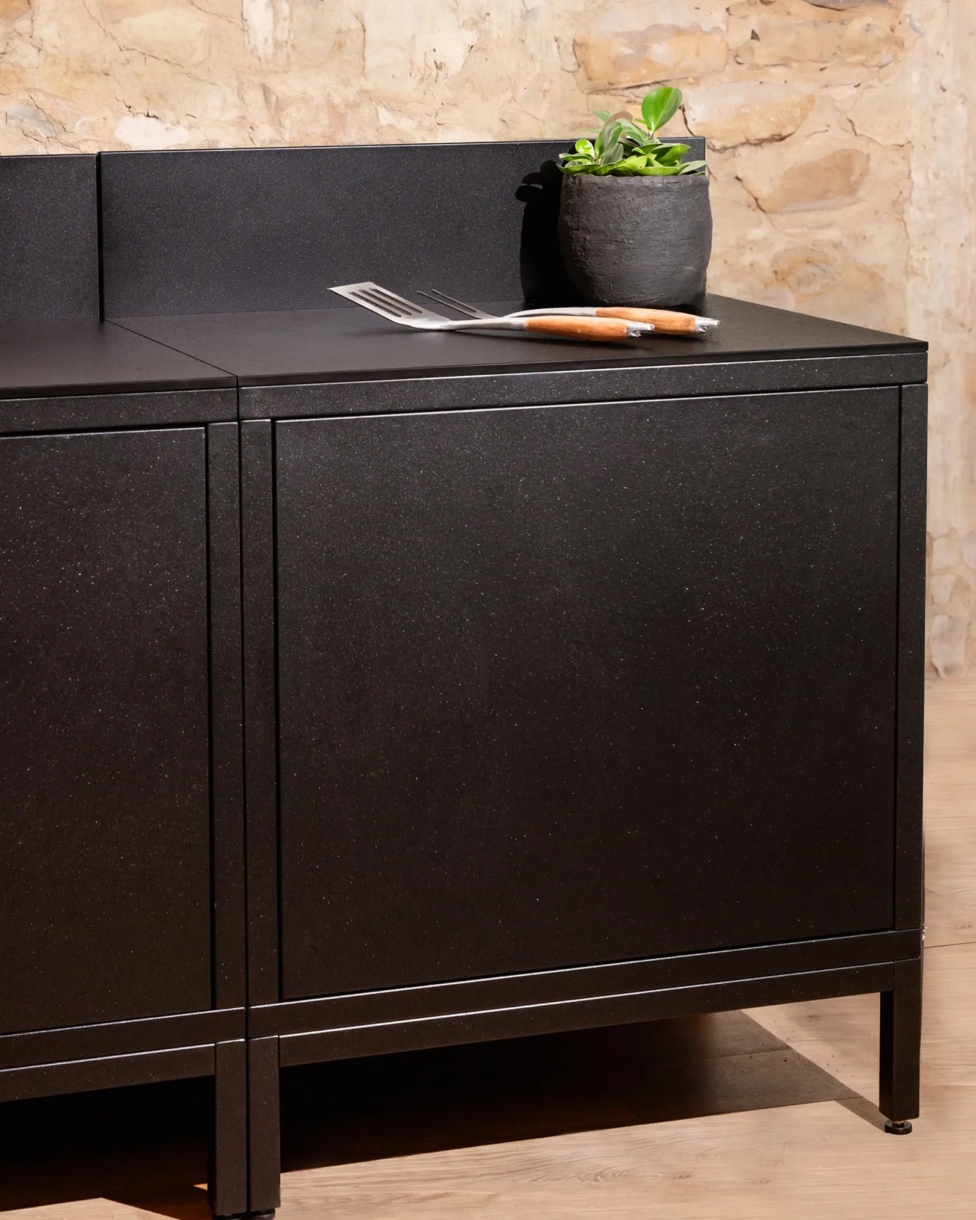 Black Classic PILOTIS module unit for outdoor kitchen, worktop with plant and cutlery