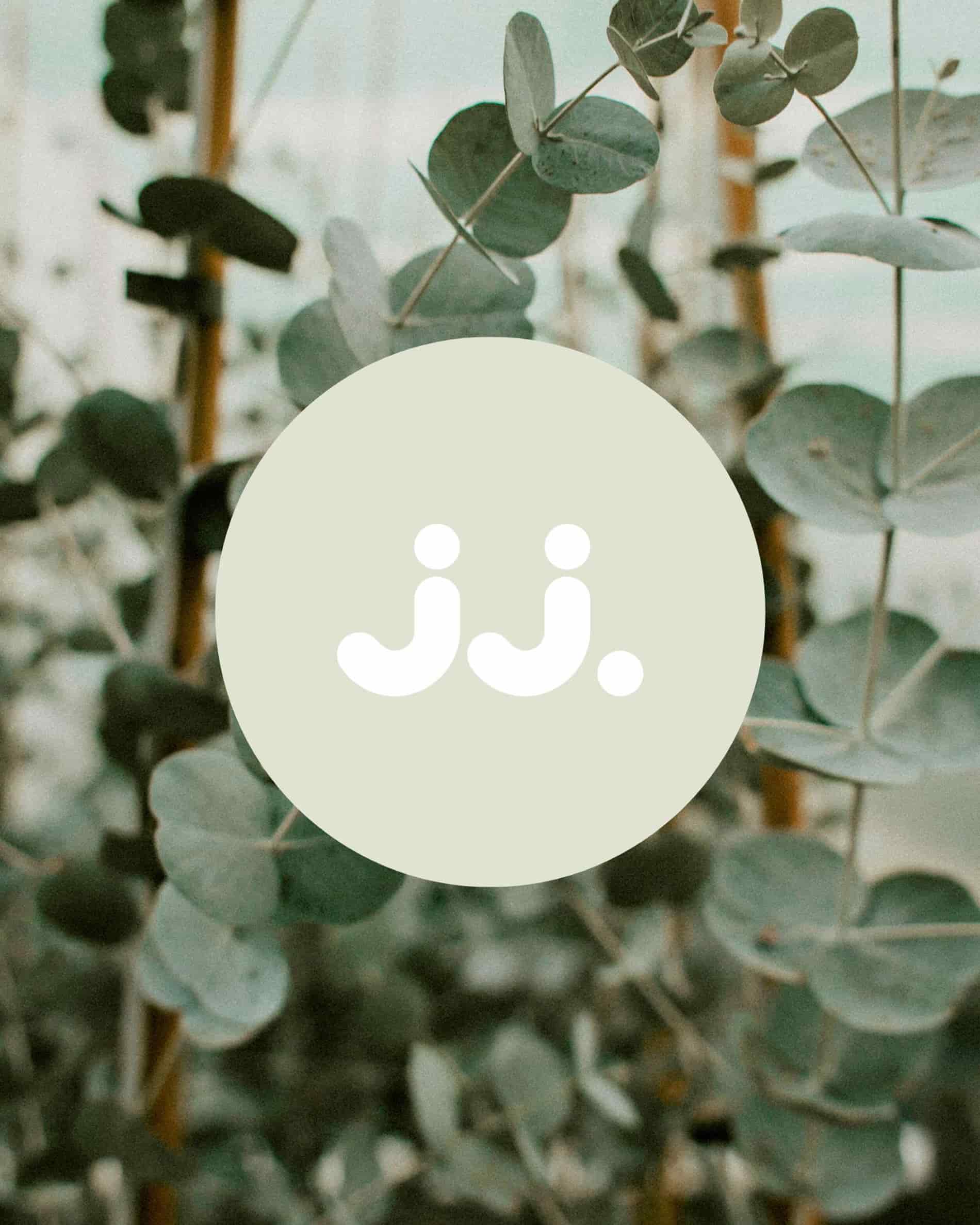 Green eucalyptus leaves with jj. logo, evoking the Citronella & Eucalyptus scent.