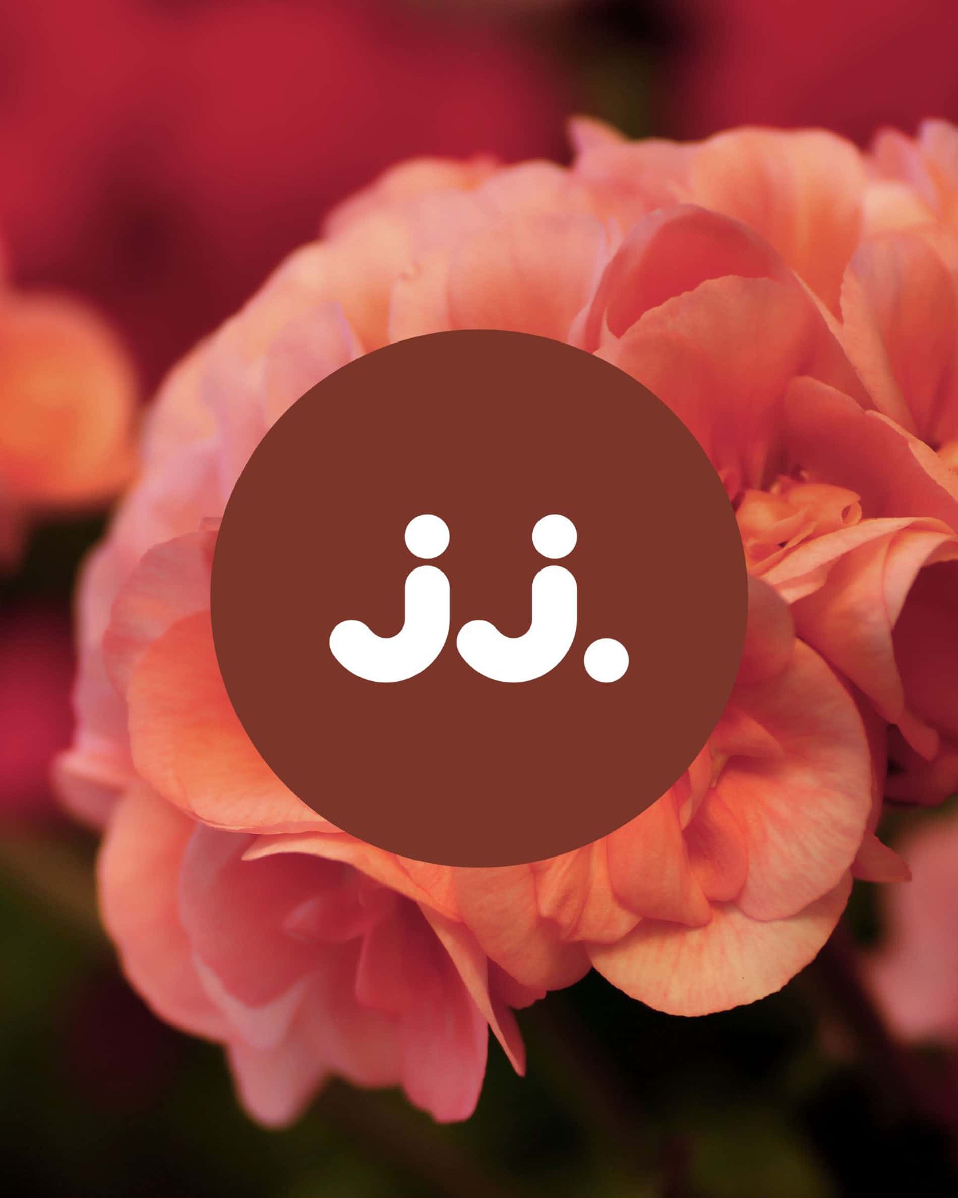 Pink geranium flowers with jj. logo, for the Citronella & Geranium scent.