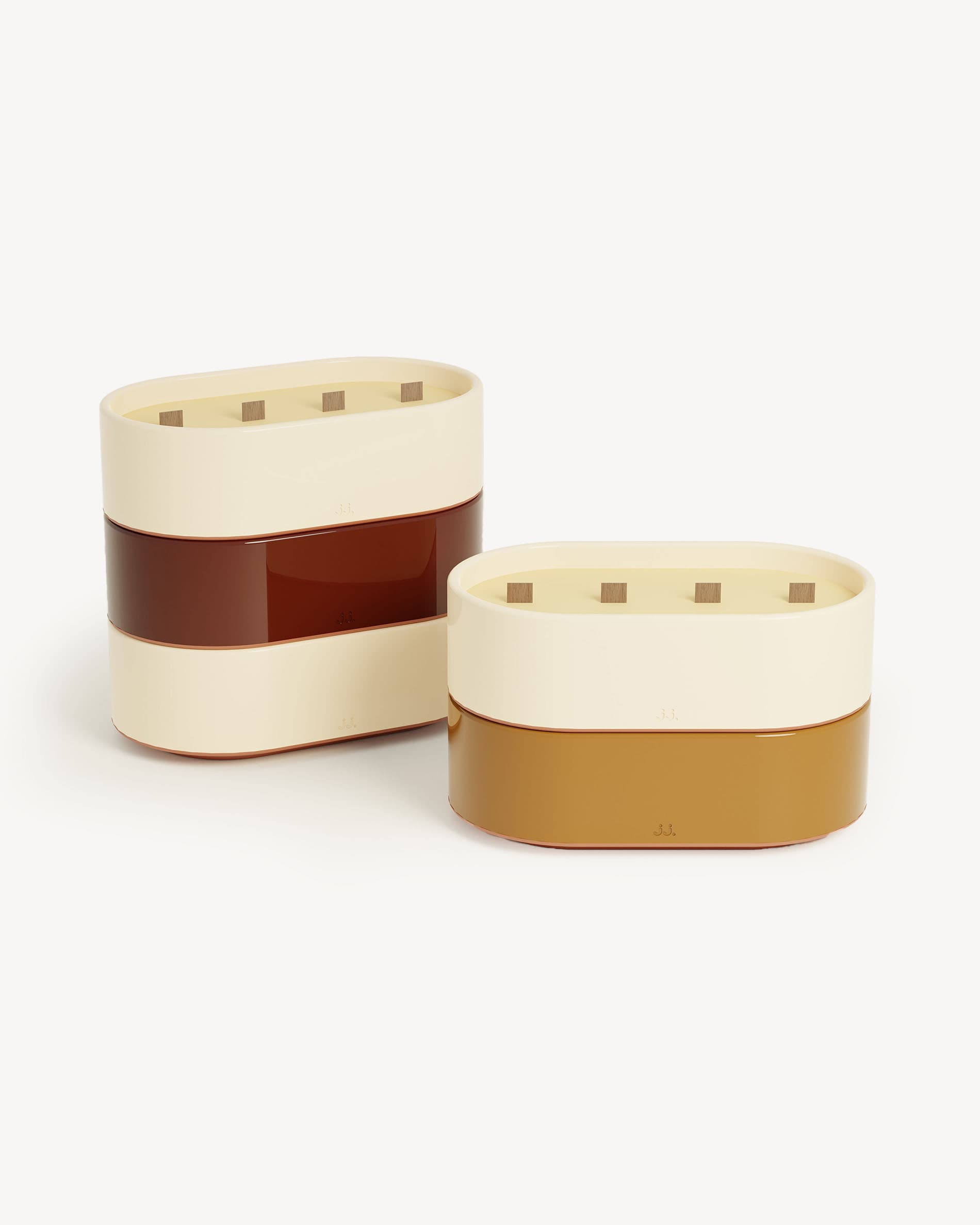 Totem L candles in ivory beige and sienna brown glazed ceramic, scented with citronella and notes of lemon and orange blossom.