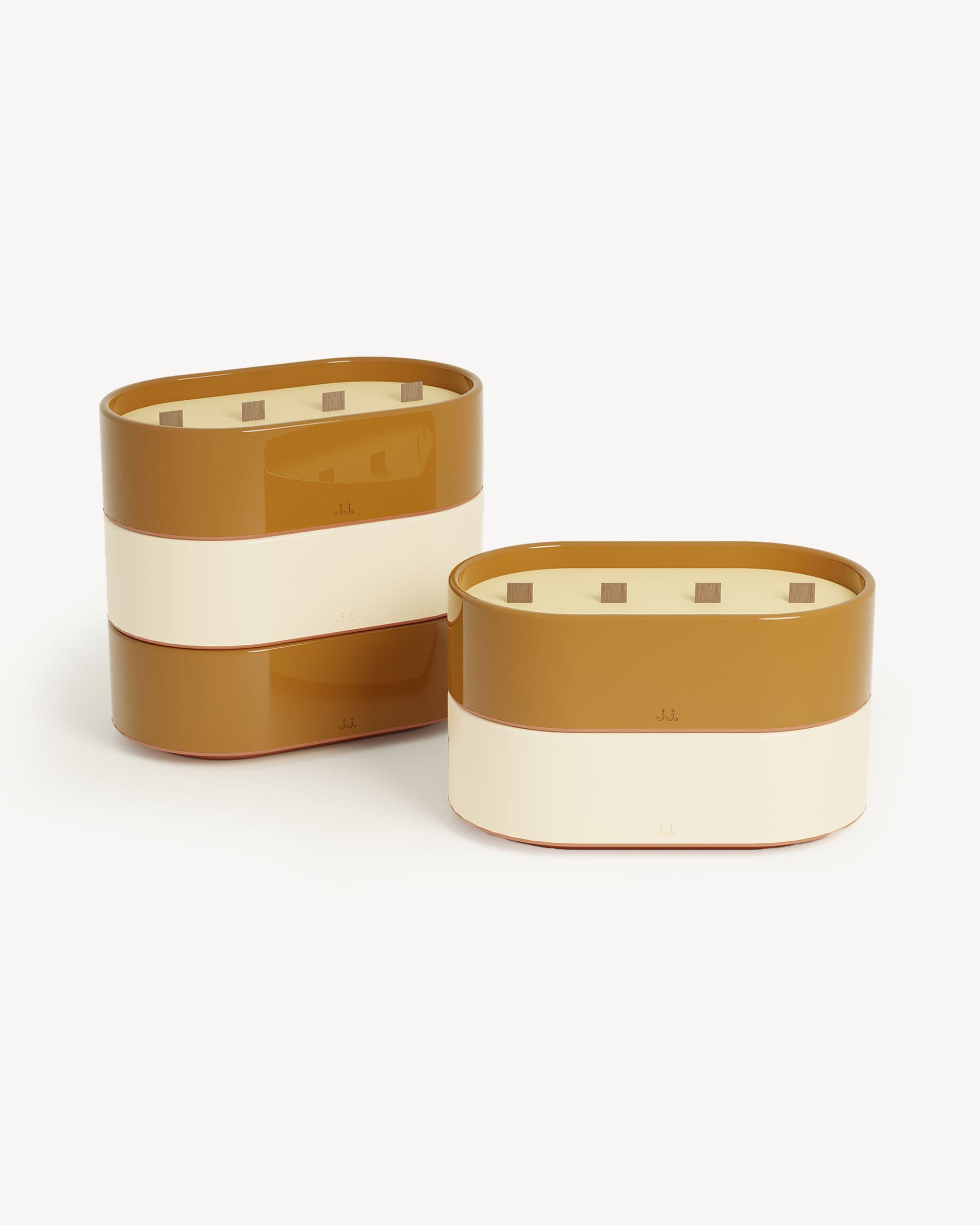 Totem L candles in ivory beige and sienna brown glazed ceramic, scented with citronella and notes of lemon and orange blossom.