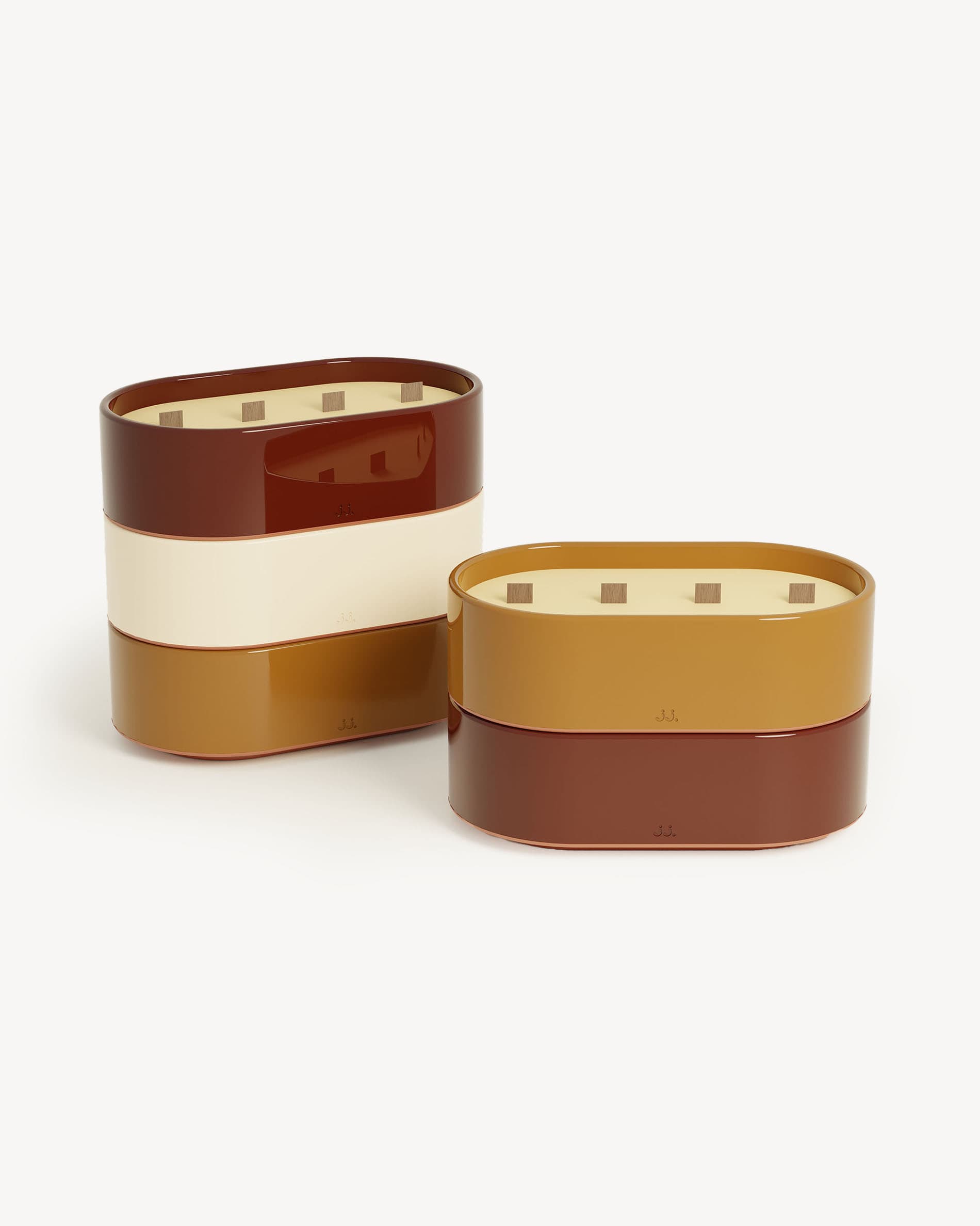 Set of two Totem L candles in red oxide and sienna glazed ceramic, scented wax with citronella, geranium, and orange blossom.