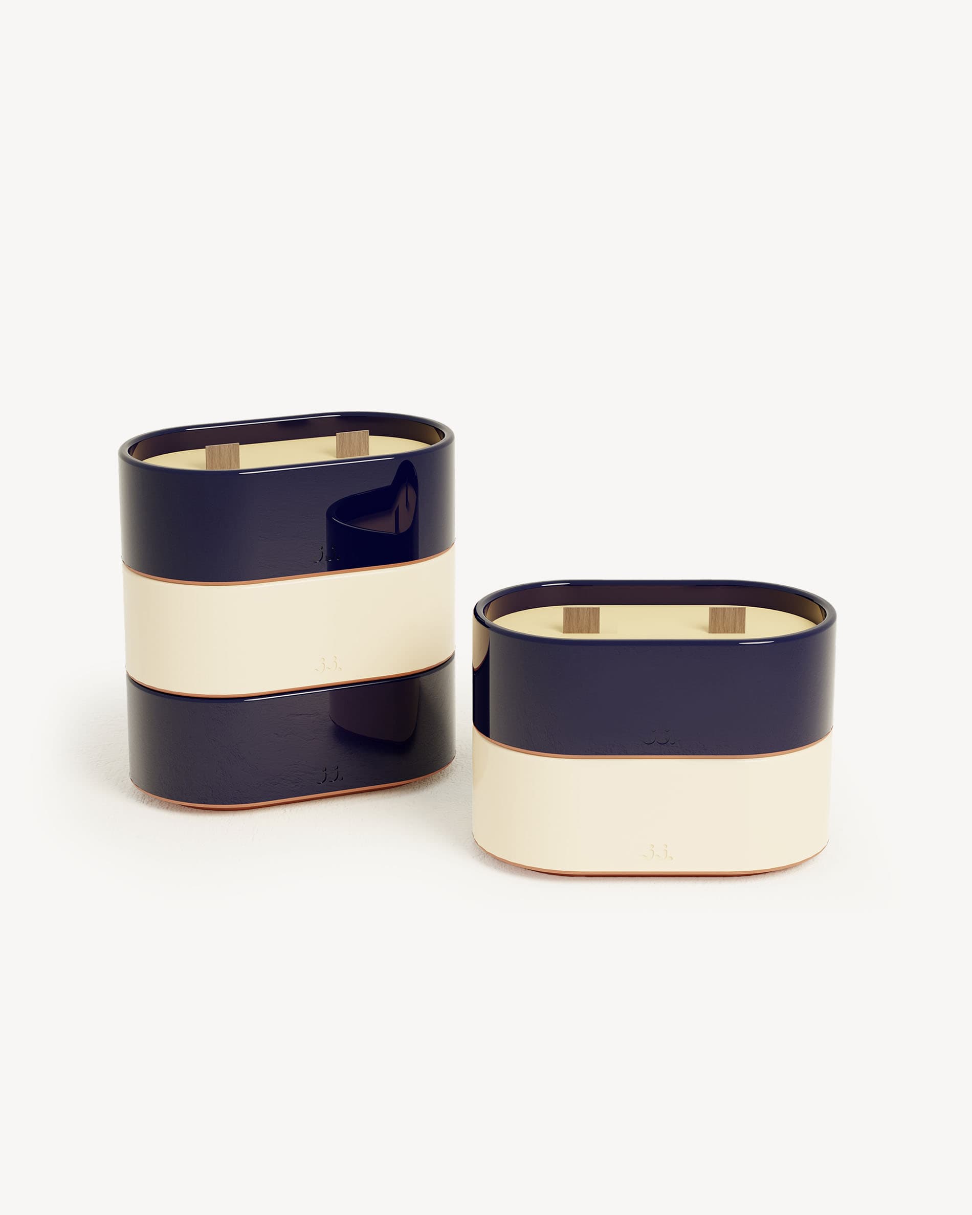 Totem S ceramic candle in two-tone ivory beige and navy blue, scented with citronella and notes of lemon and sea salt.