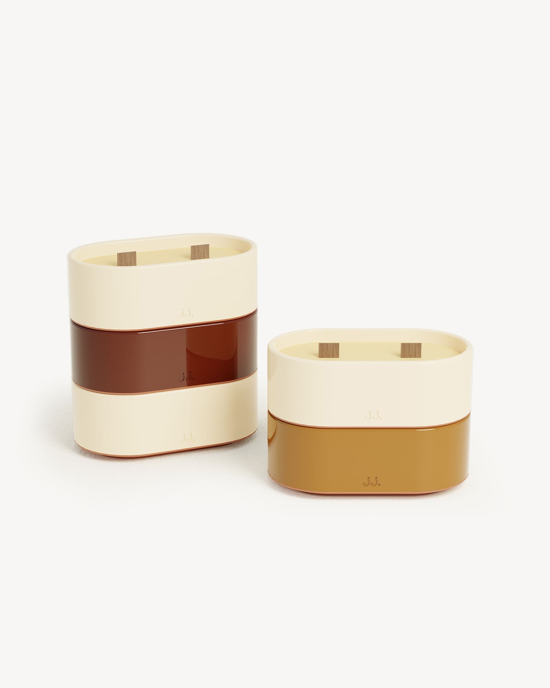 Totem S ceramic candle in two-tone ivory beige and oxide red, scented with citronella and hints of geranium.