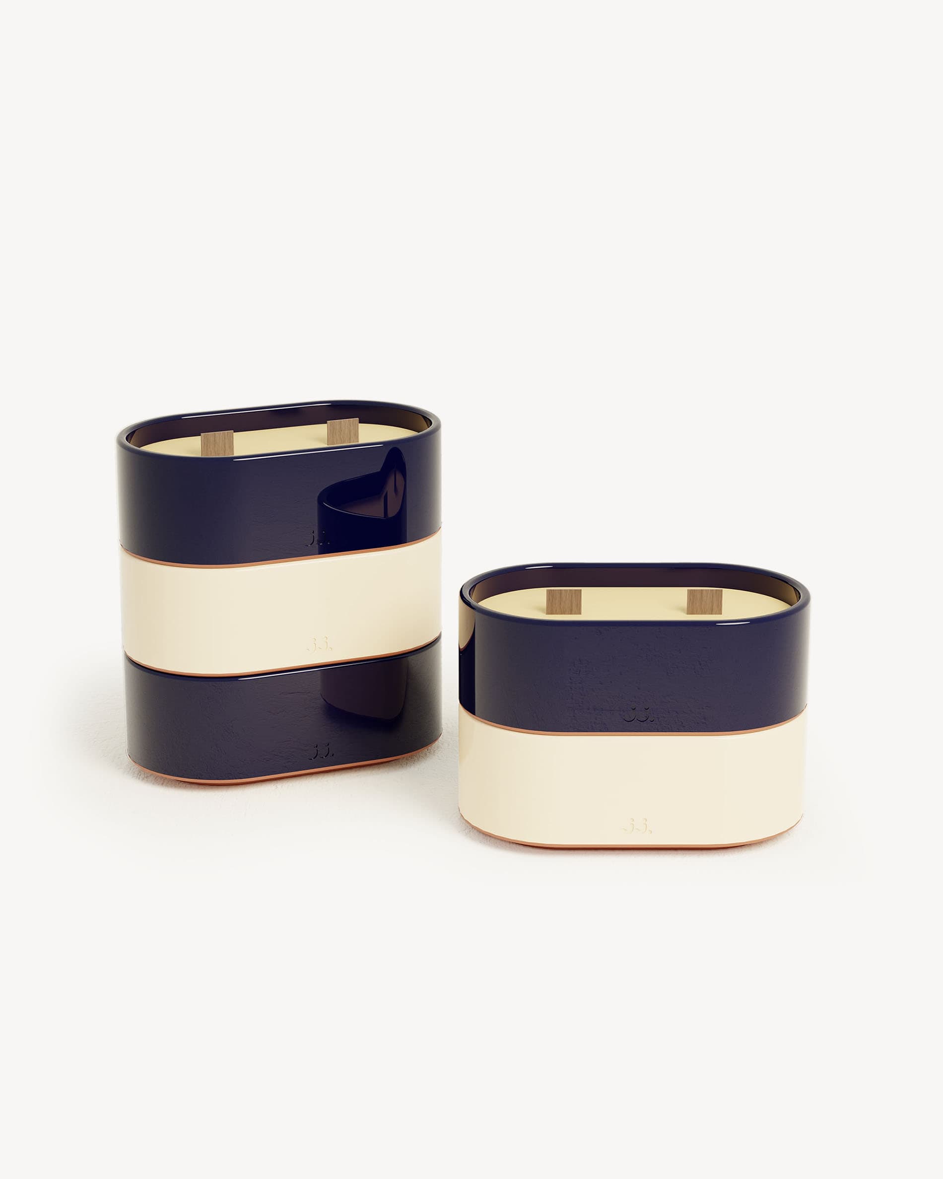 Totem S candle in two-tone ivory beige and navy blue ceramic, scented with citronella and notes of lemon and sea salt.
