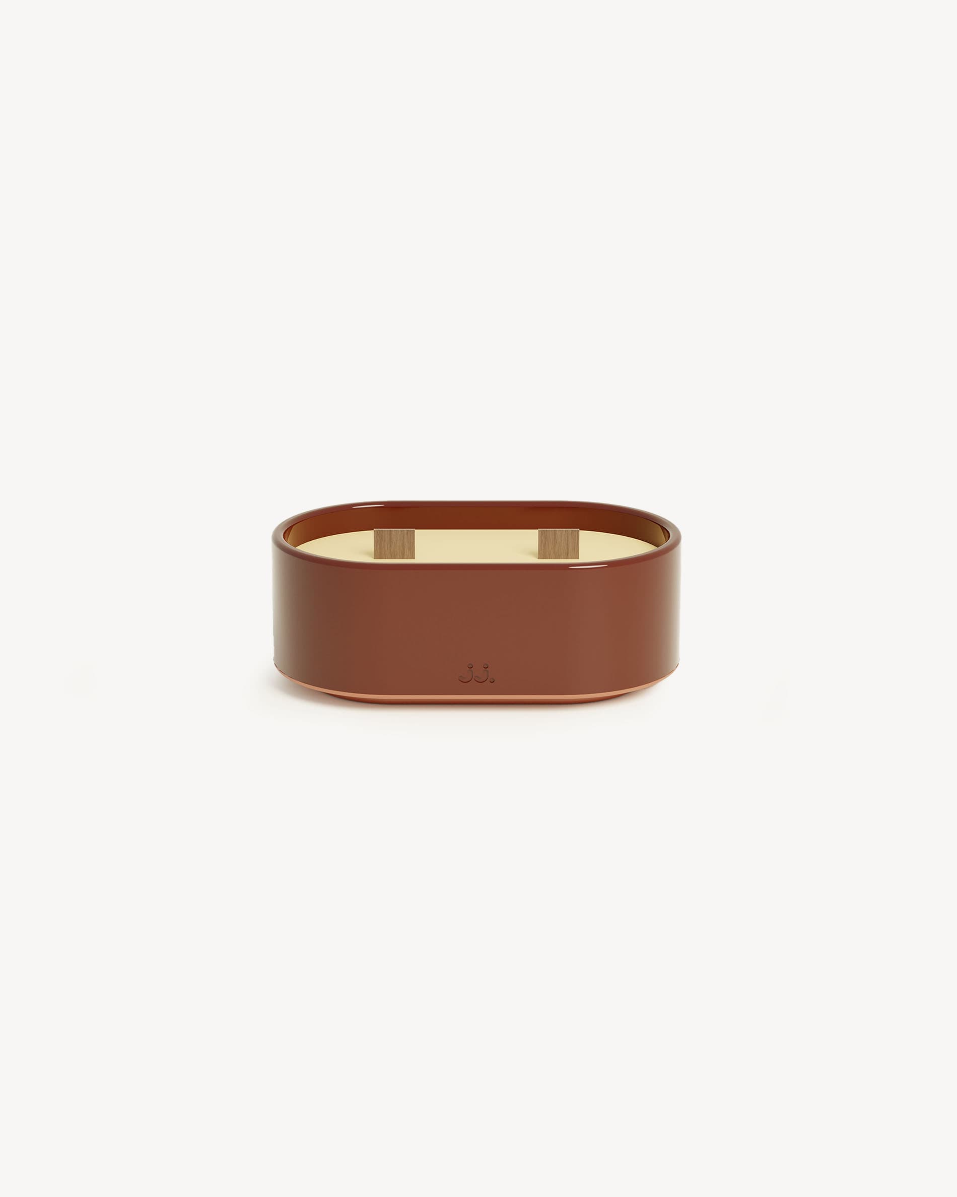 Totem S candle in red oxide glazed ceramic, scented with citronella and geranium notes.