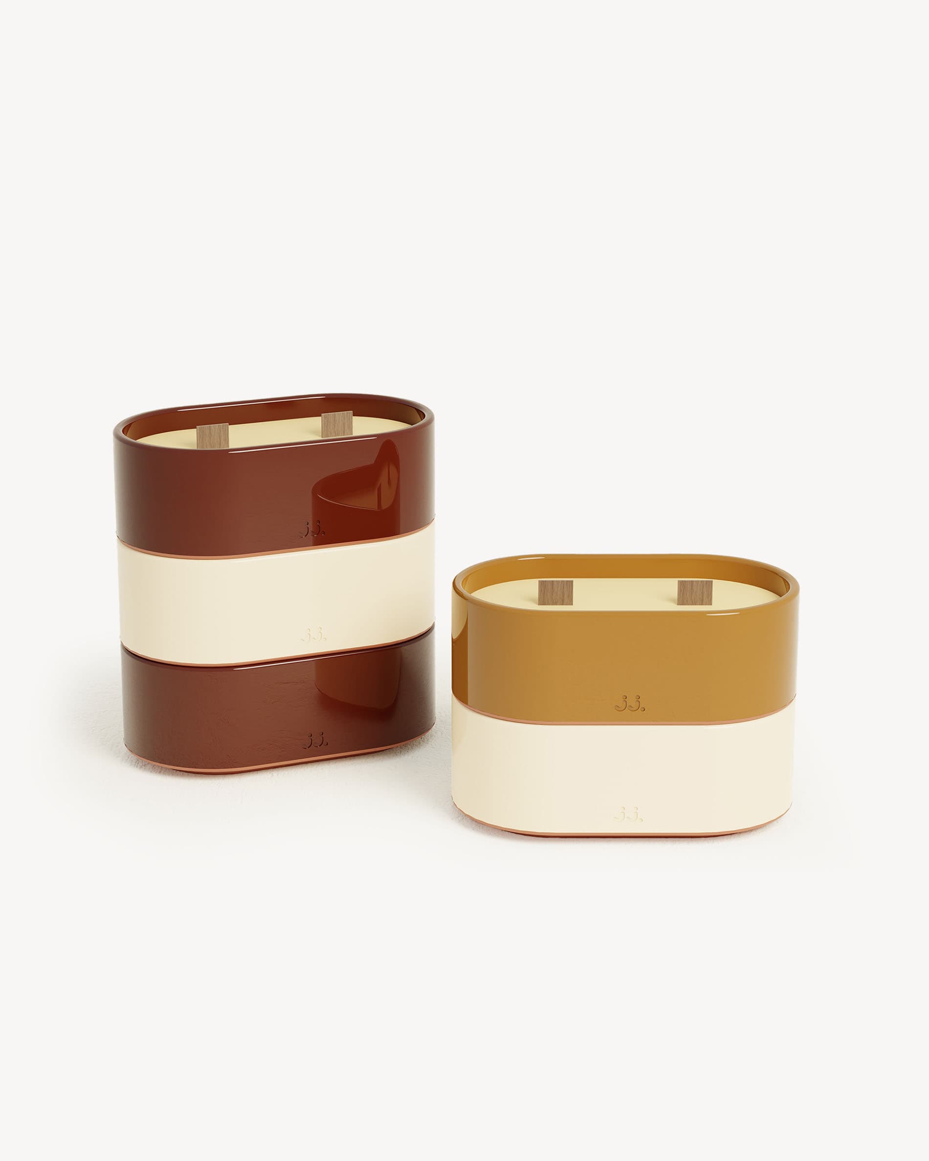 Totem L ceramic candle in two-tone ivory beige and sienna brown, scented with citronella and notes of orange blossom.