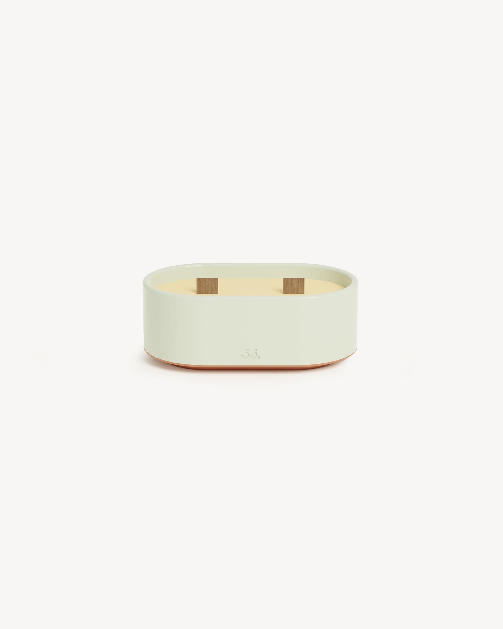 Totem S ceramic candle in water green, scented with citronella and eucalyptus.