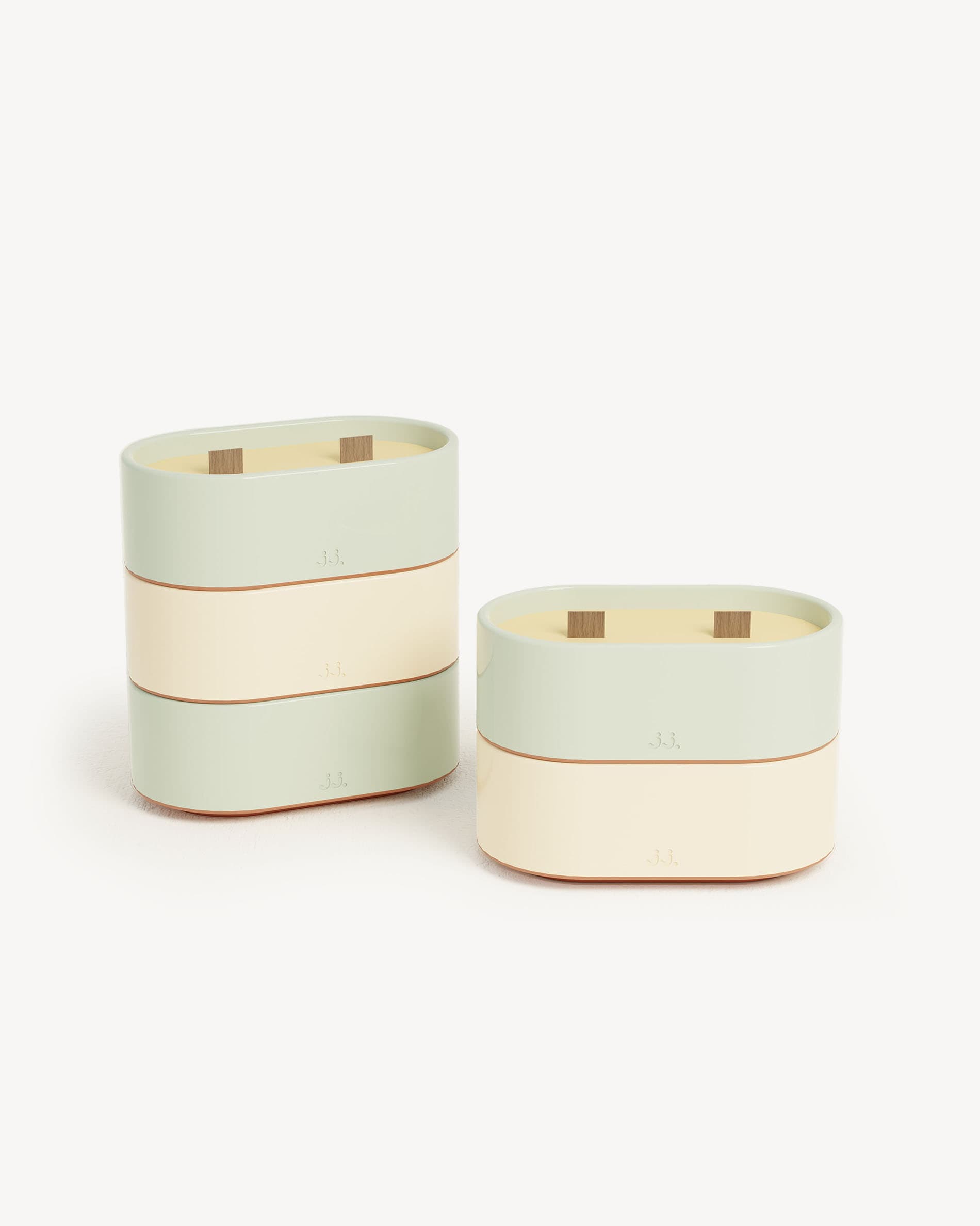 Set of Totem S candles in water green and ivory beige, scented wax with citronella, eucalyptus, and lemon.