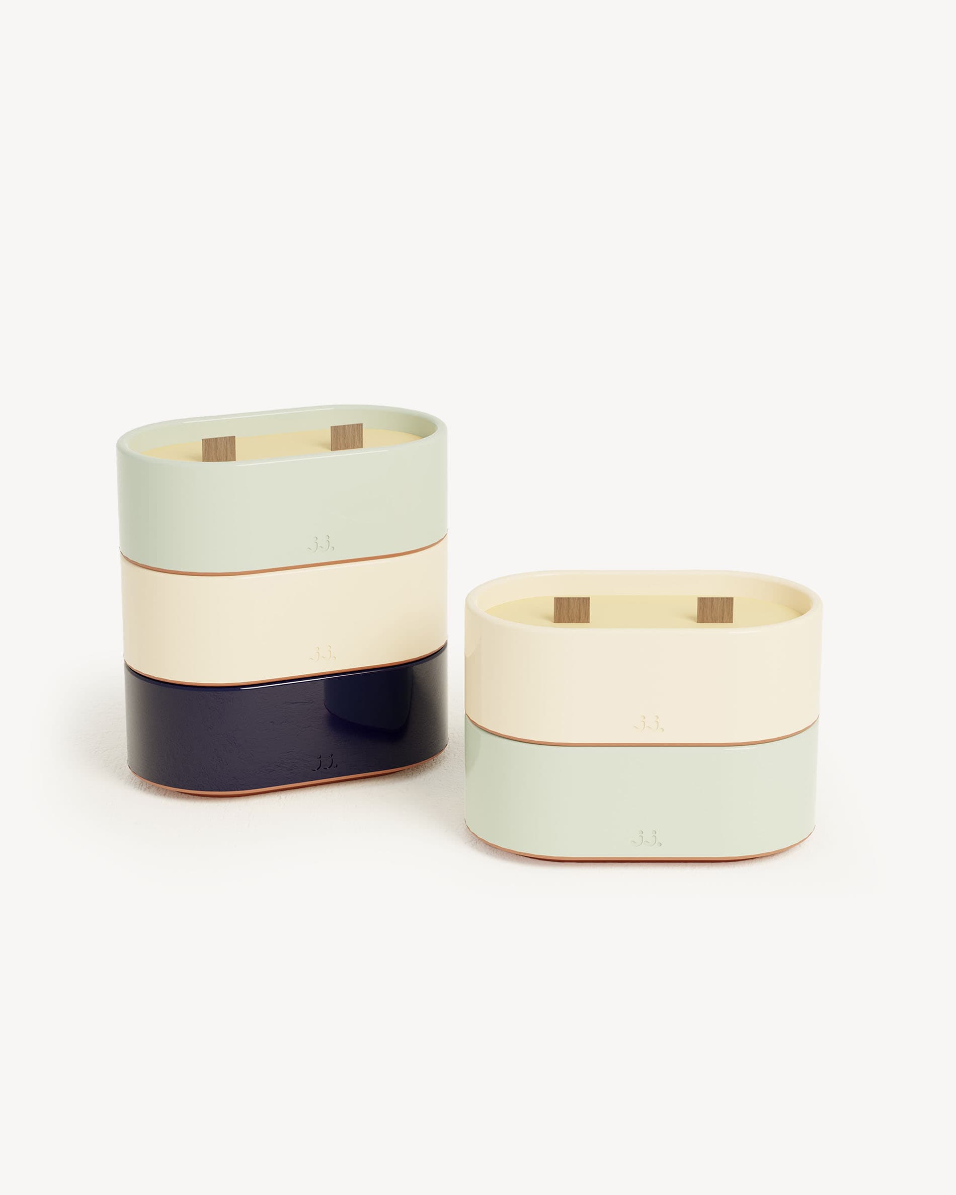 Totem S candle set in water green and ivory beige, scented wax with citronella, eucalyptus, and lemon.