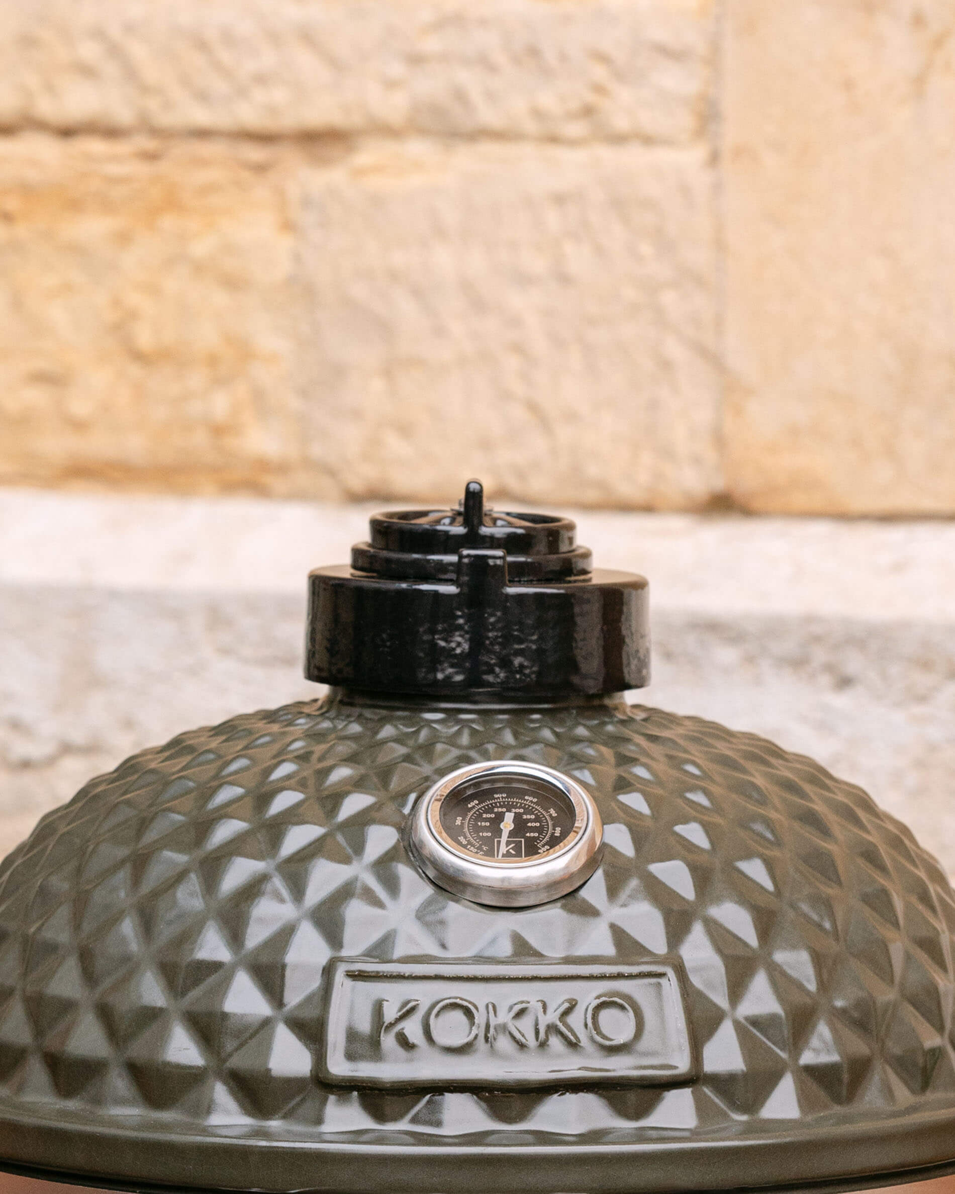 Cast iron chimney installed on the lid of a Kokko kamado.