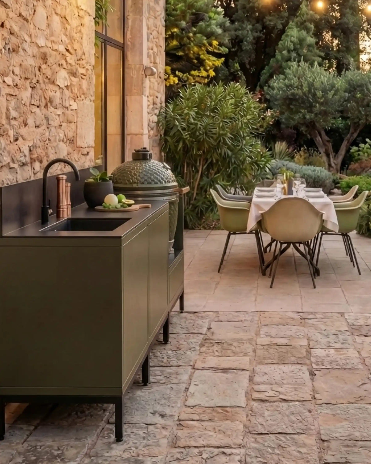Kokko Pilotis olive outdoor kitchen with sink and outdoor dining area