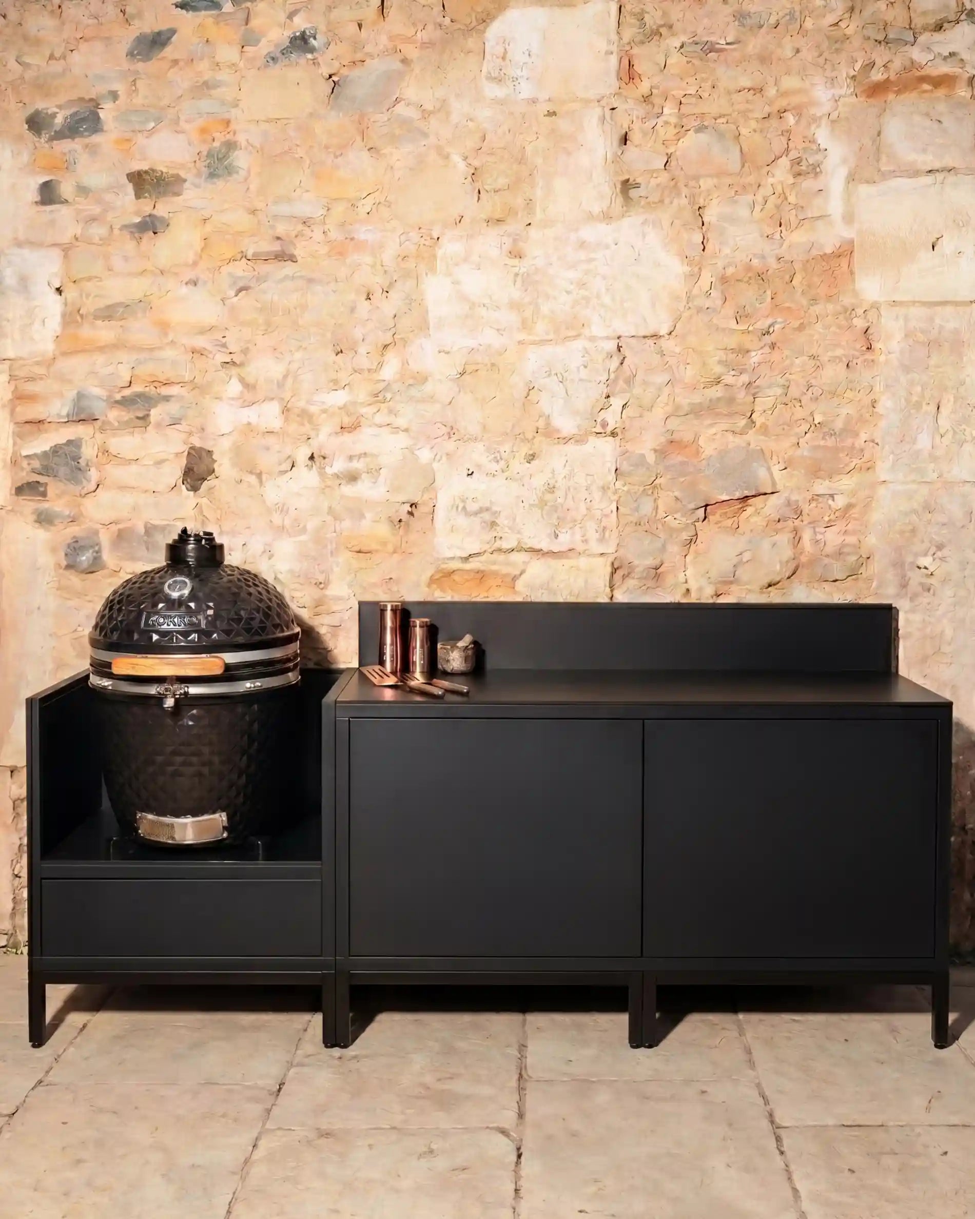 Kokko Pilotis black outdoor kitchen with kamado and integrated storage