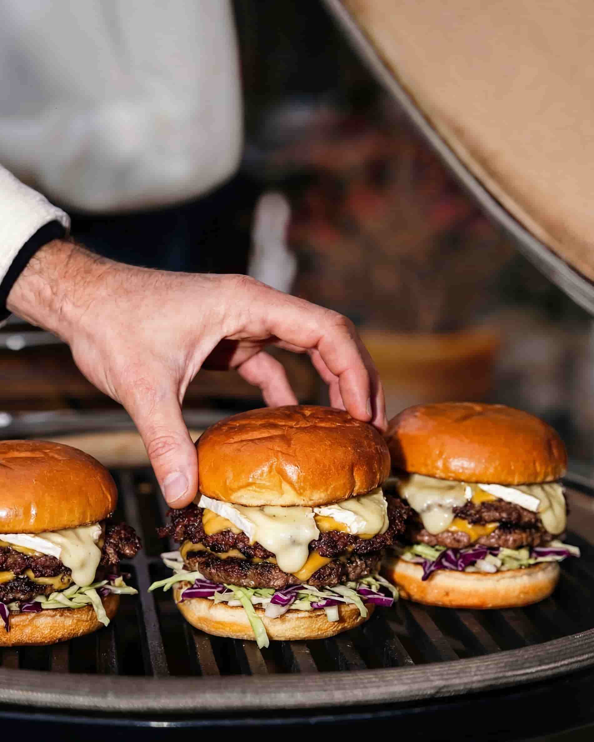Cast iron grill with hamburgers