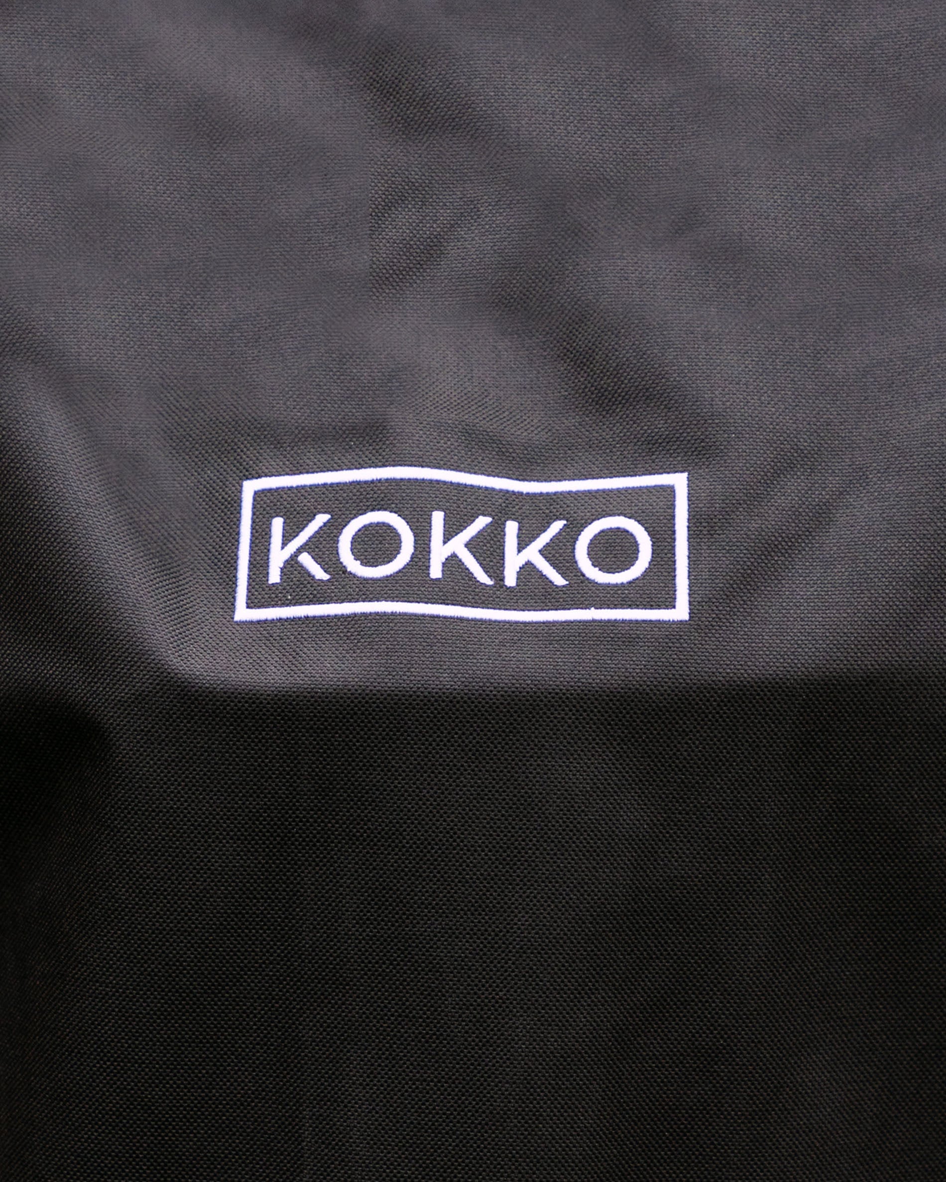 Black Kokko protective cover with white logo, designed for Kokko kamados.