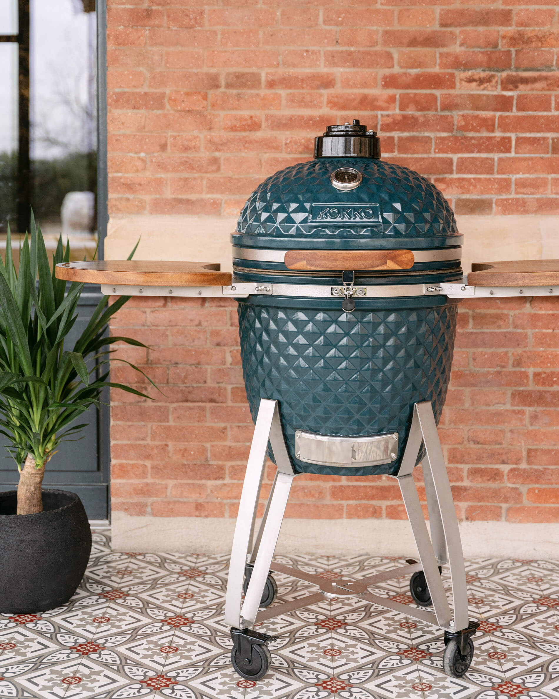 Kokko XL 22-inch ceramic kamado in ocean blue on cart.