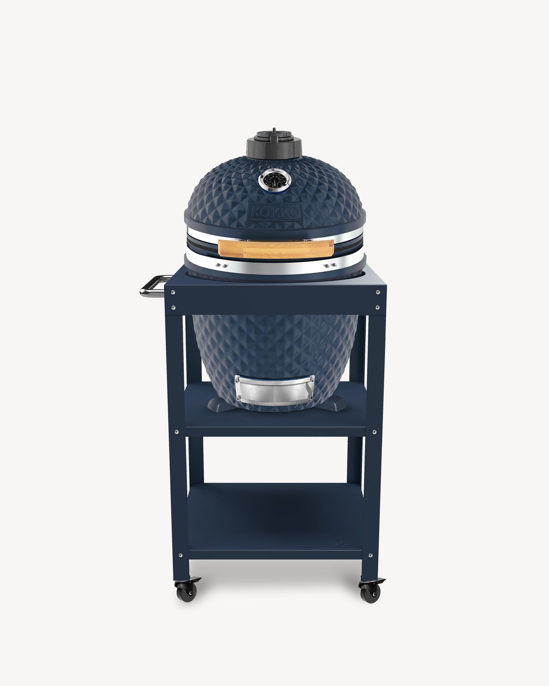 Kokko L 18-inch navy kamado barbecue, set up on a trolley with storage and wheels.