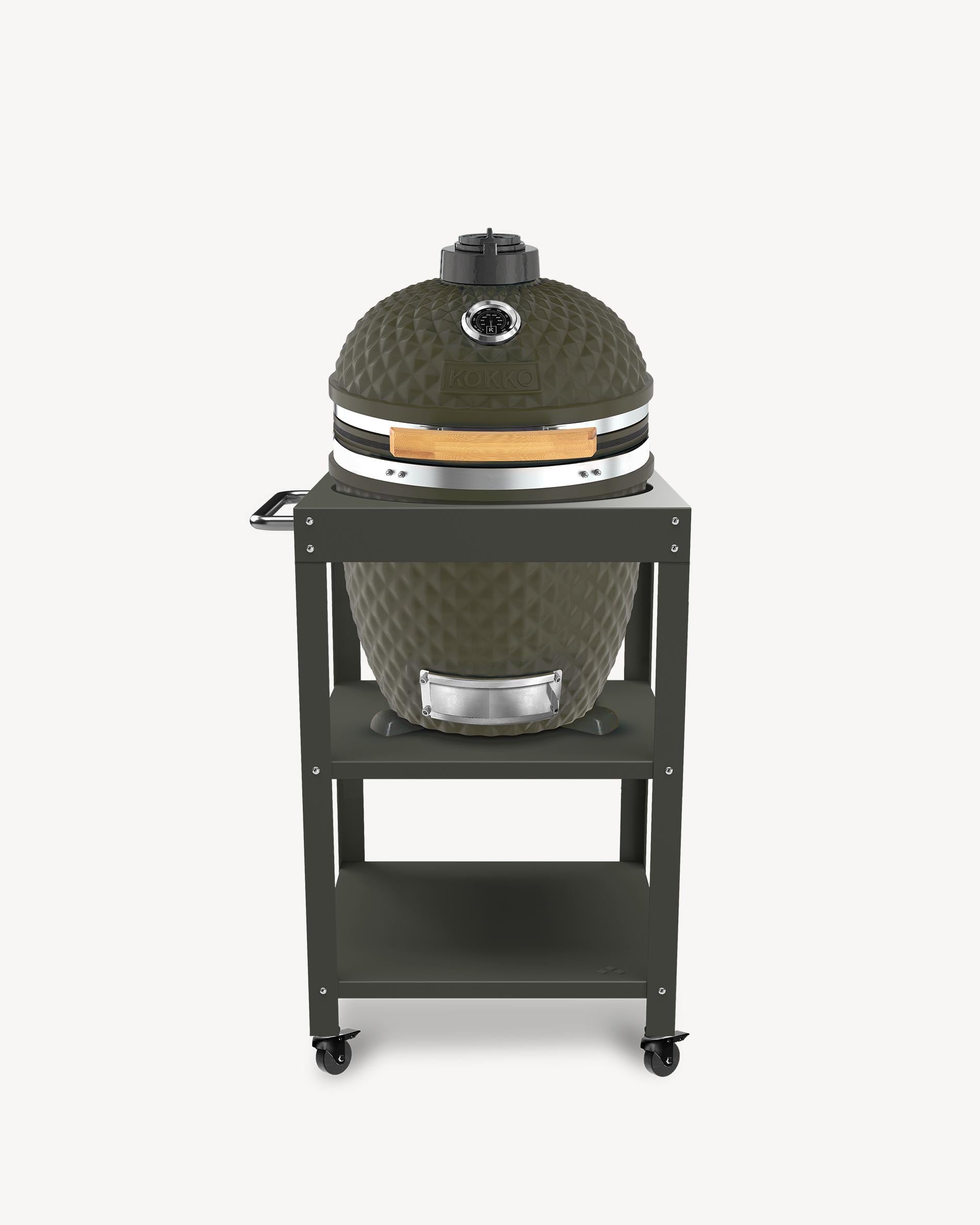 Kokko L 18-inch olive kamado barbecue, set up on a trolley with storage and wheels.