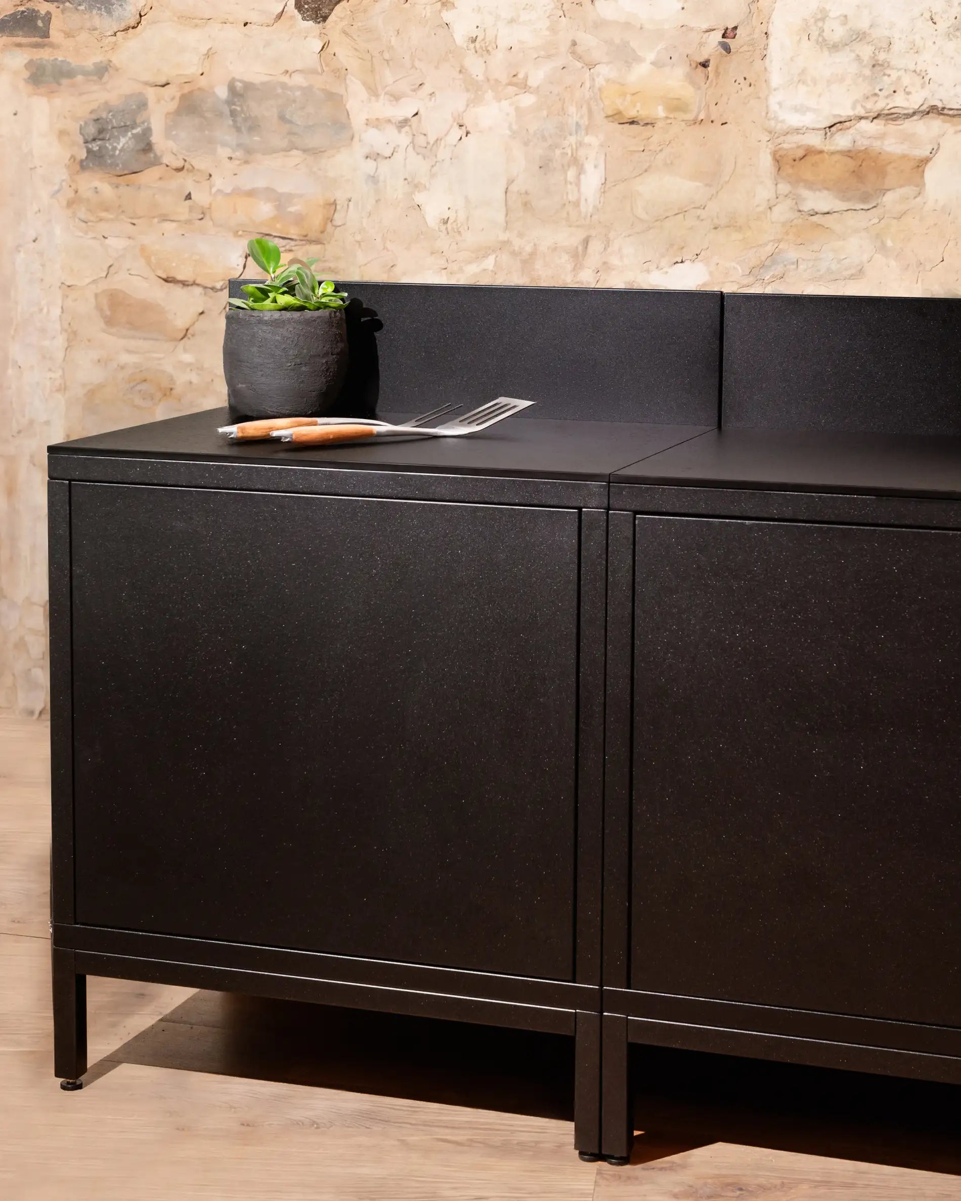 Kokko black storage module with closed doors and black worktop