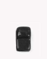 Black ceramic stand designed to stabilize a Kokko kamado.