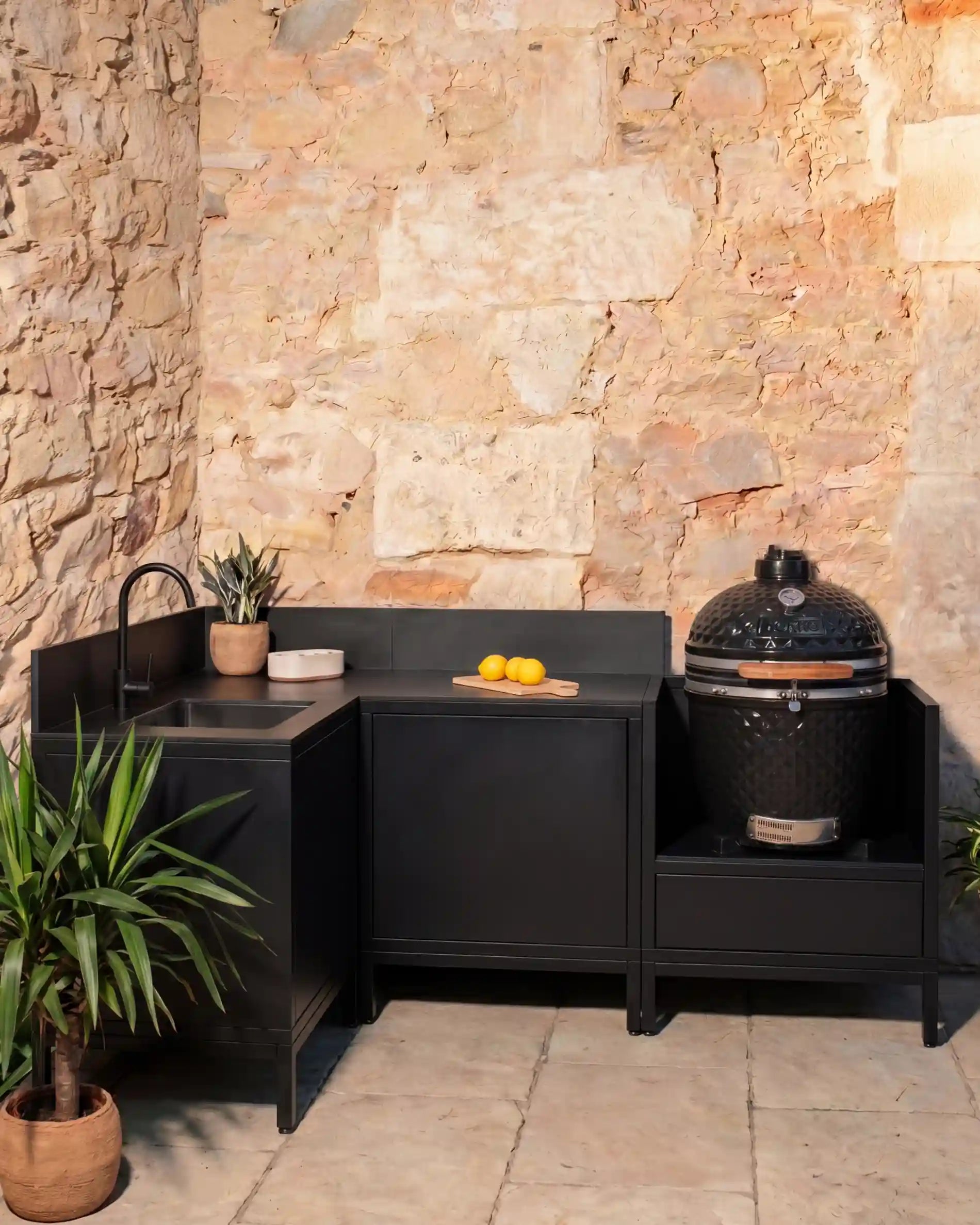 Kokko black corner outdoor kitchen with sink and built-in kamado