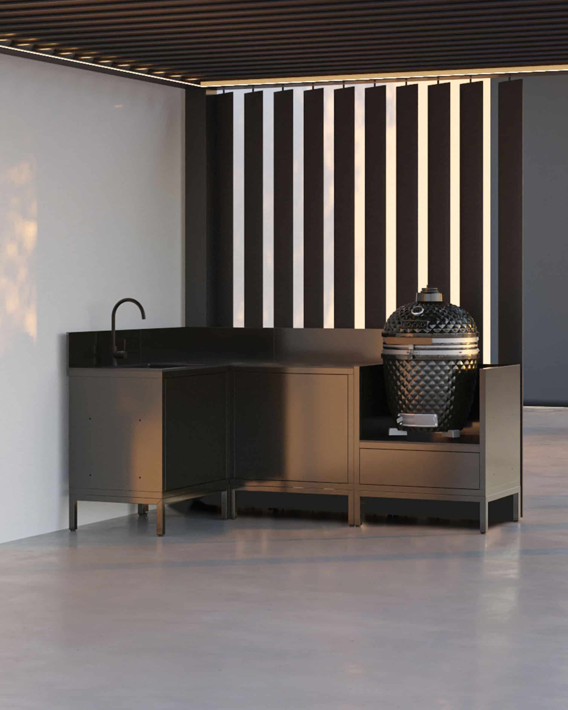 Cuisine pilotis avec kamado, configuration d’angle noire sous pergola, meubles fermés et plan de travail intégré.