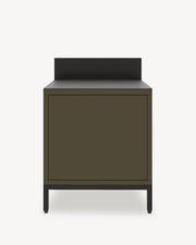 Classic pilotis outdoor kitchen module, olive green unit with closed storage, dark countertop and integrated backsplash.