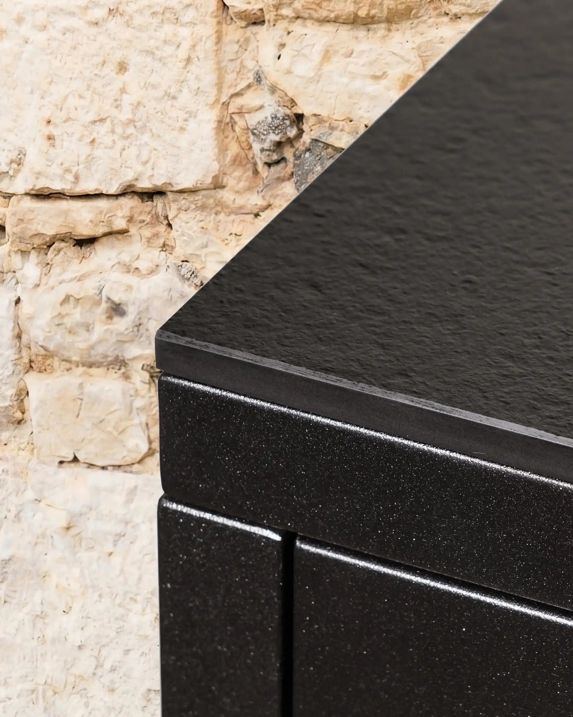 Textured black worktop detail of Kokko outdoor kitchen