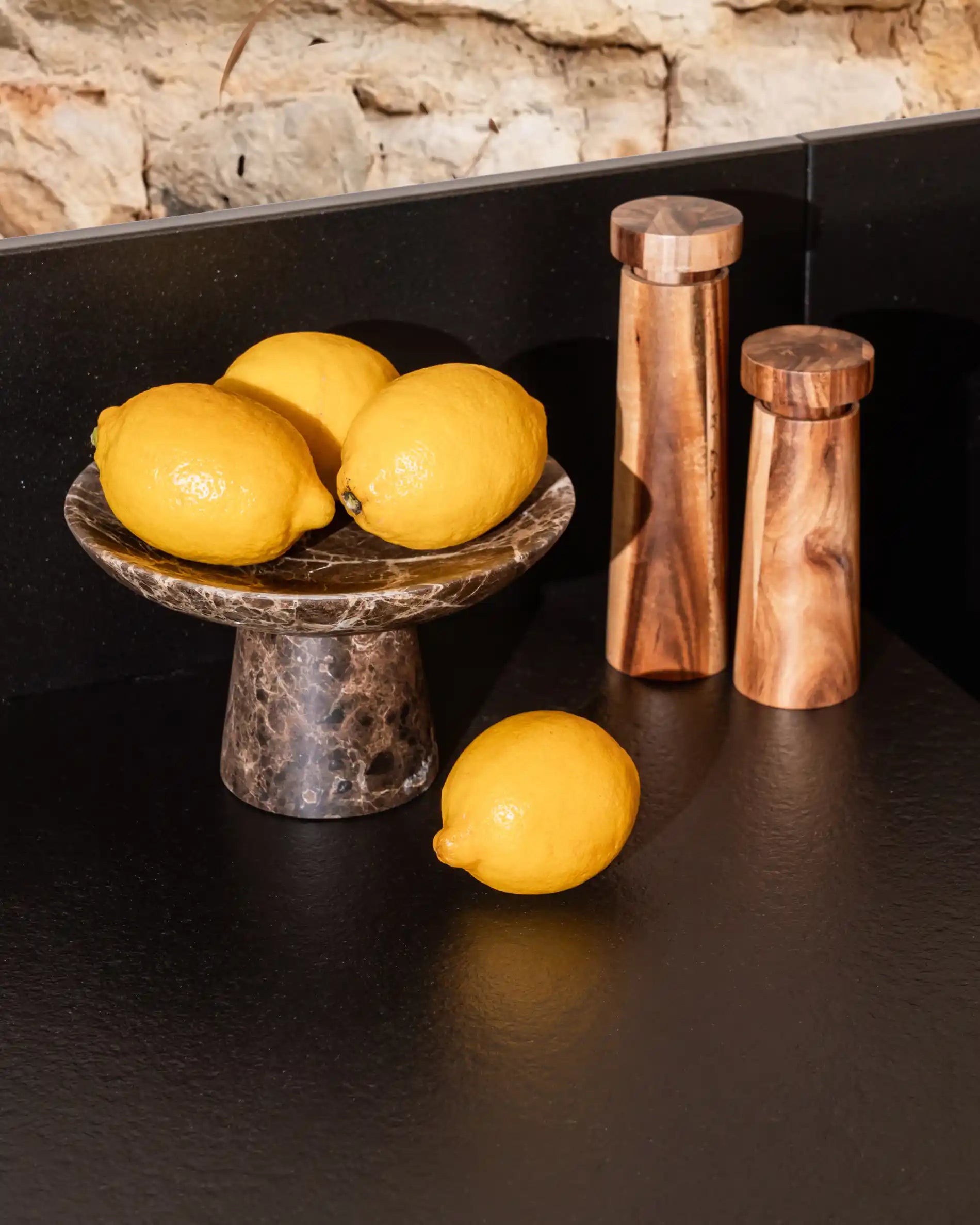 Oranges placed on black worktop of Kokko outdoor kitchen