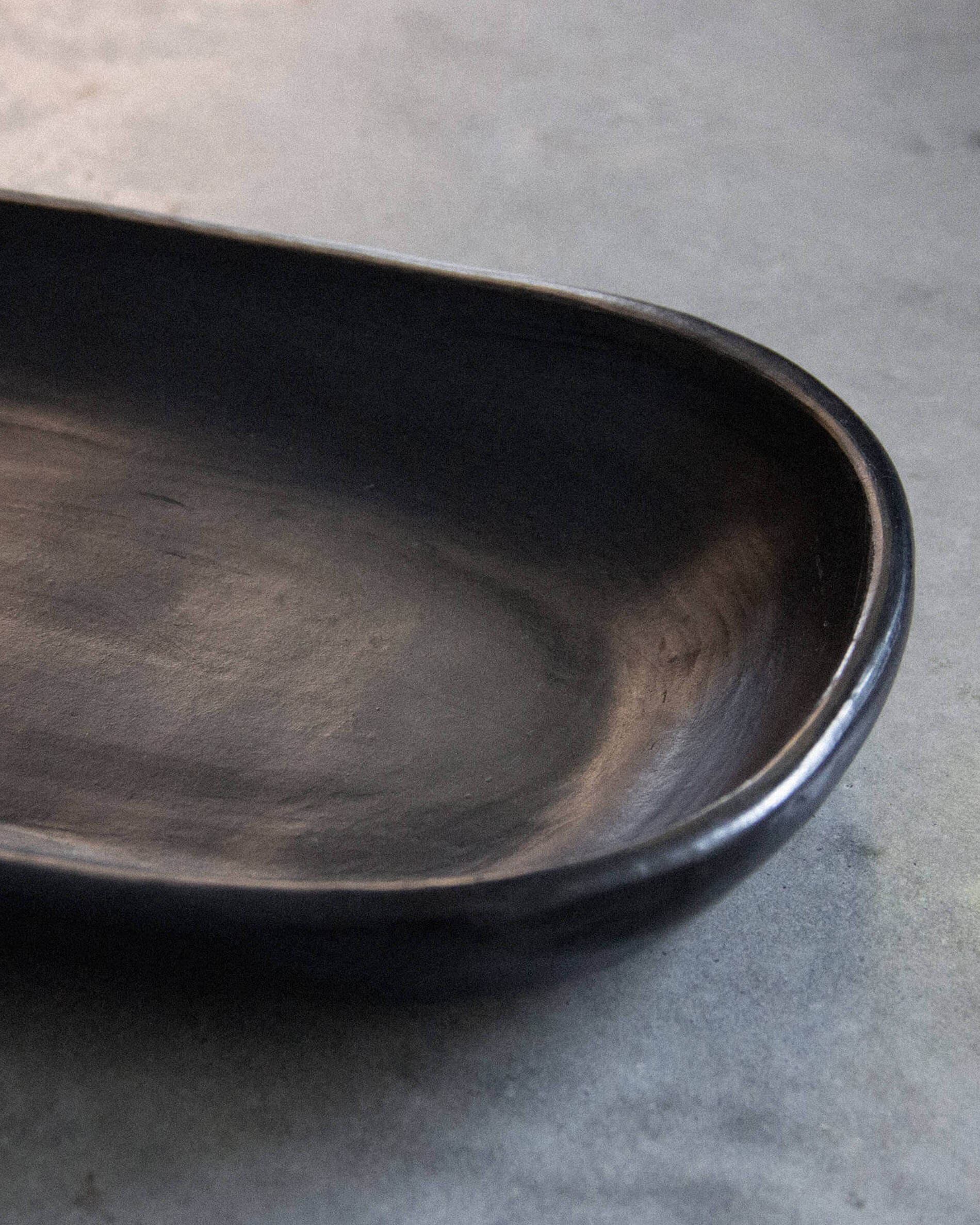 Chamba black clay cake dish
