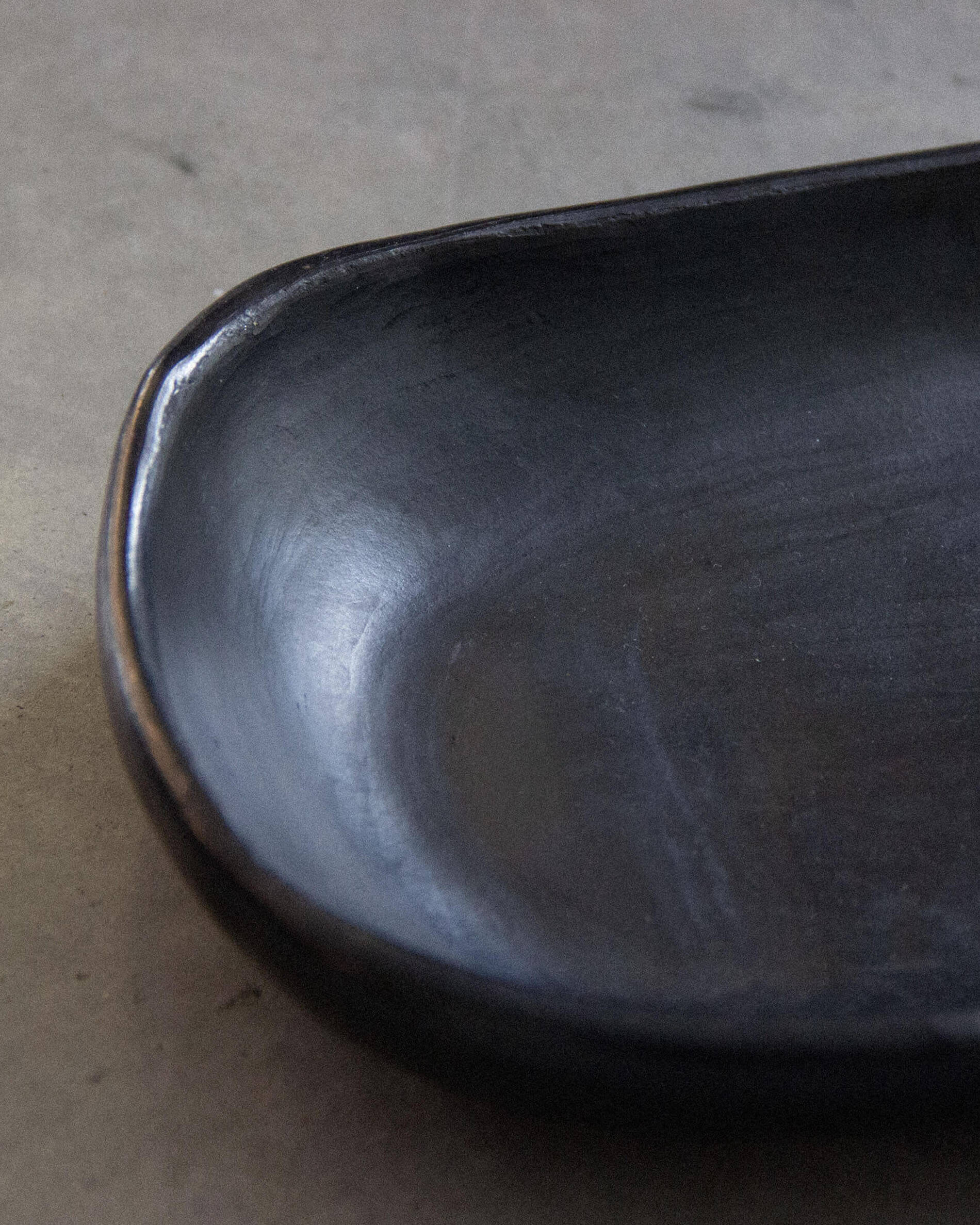 Chamba black clay cake dish