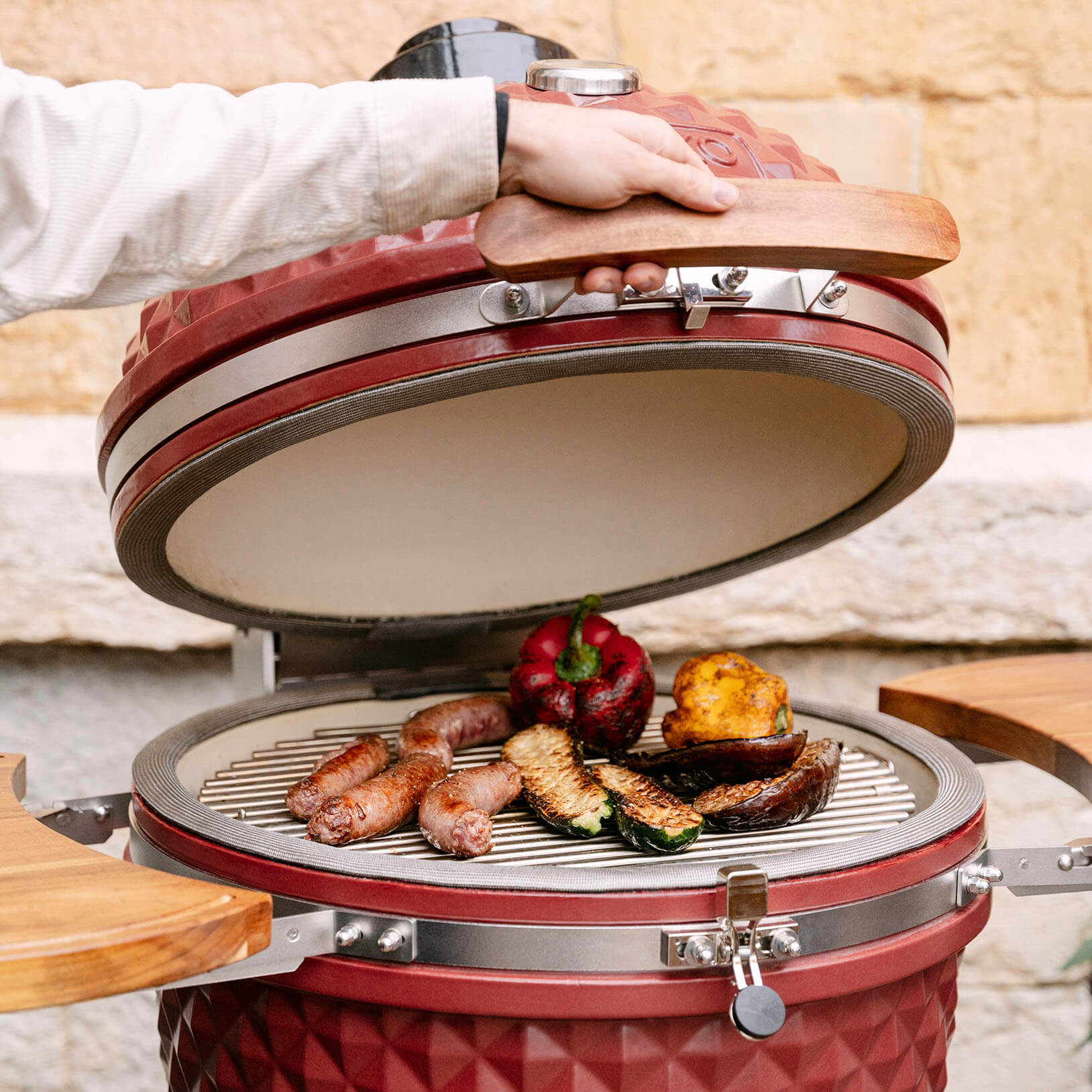 Kamado Kokko 22-inch new edition showcasing versatile cooking: grilling, indirect heat, and smoking.