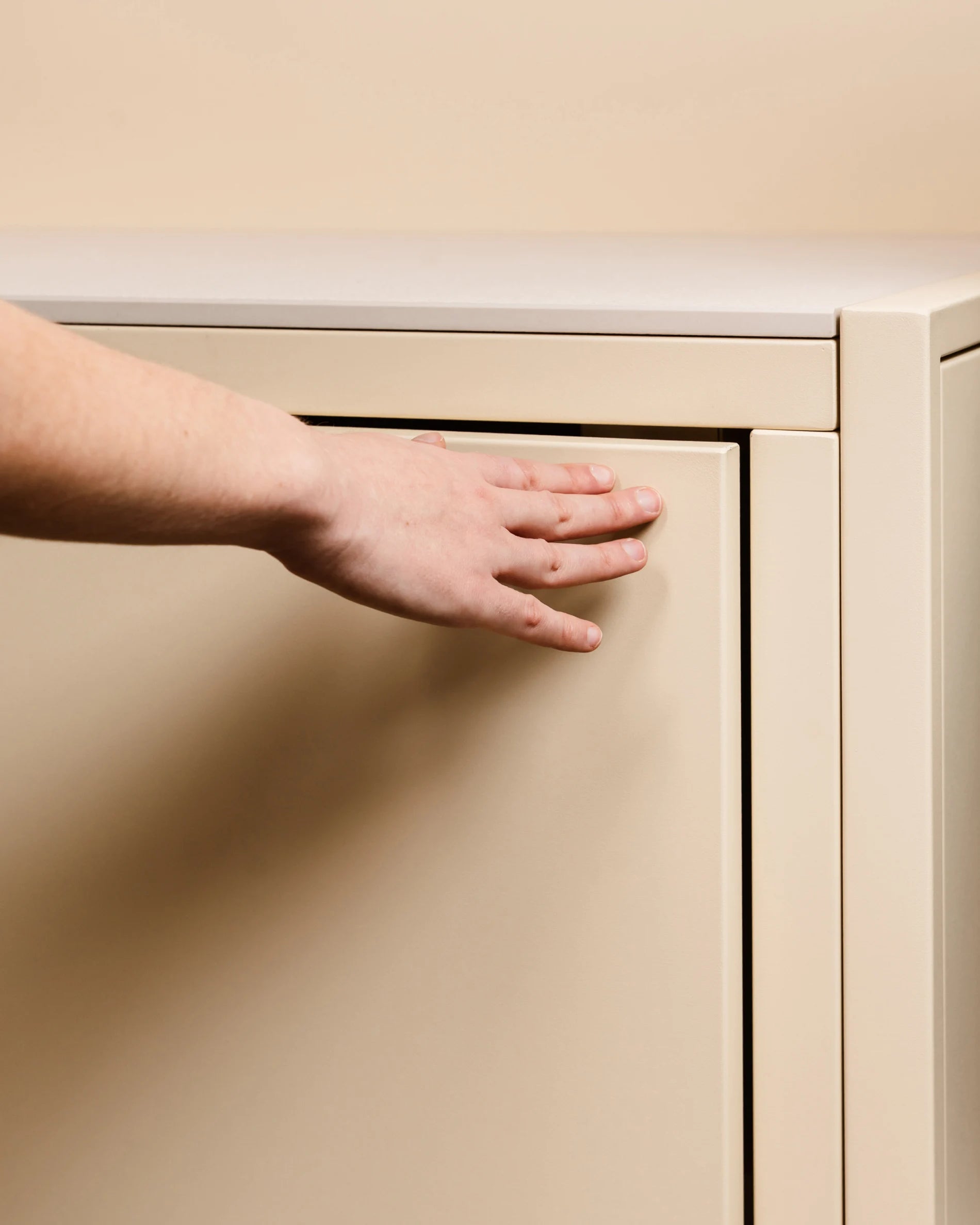 Push-pull opening on Kokko cream outdoor kitchen unit