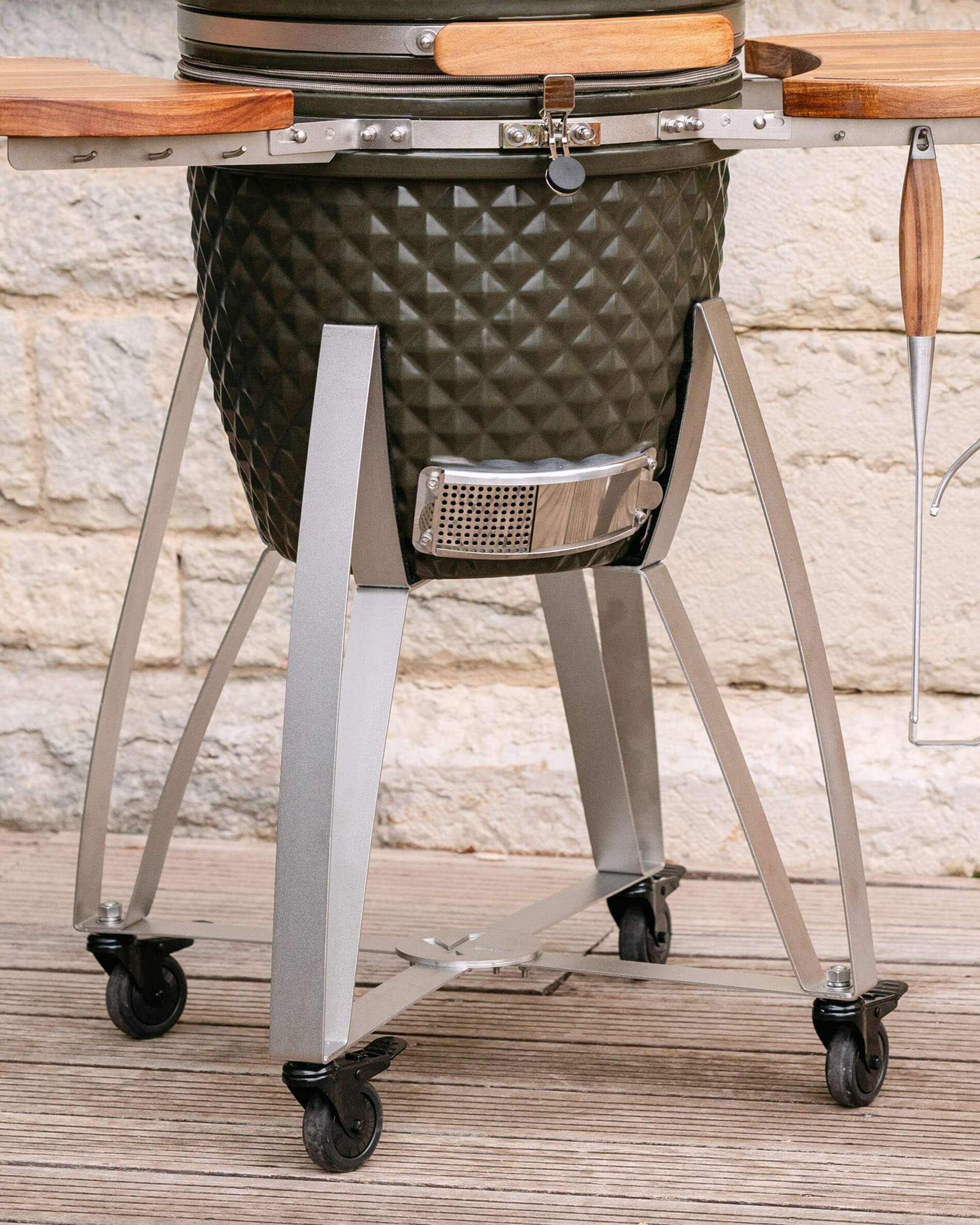 Stainless steel trolley for Kokko kamado with shelf and wheels.